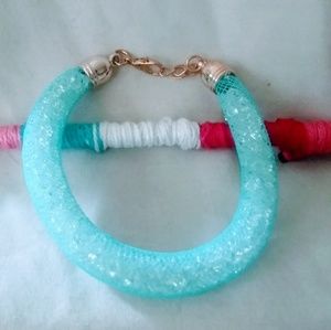 Turquoise blue mesh bracelet filled with crystals